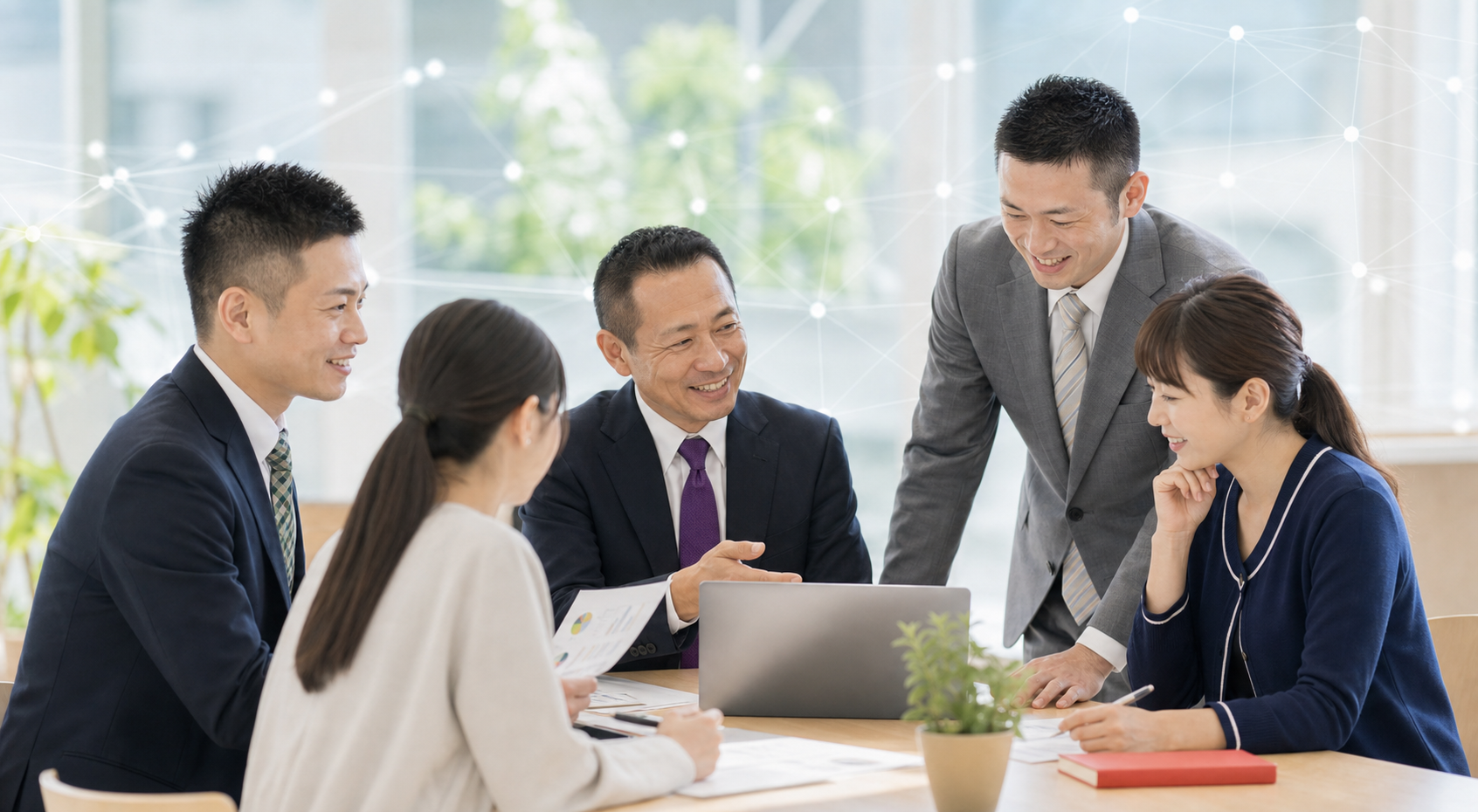 AI時代の技術と人のつながりを大切にしながら話し合うスタッフ